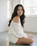 En pull blanc femme